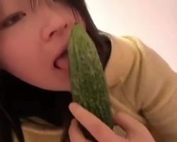 Solo masturbation of cute Japanese girl pleasing herself with a veggie and tasting her juices