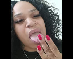 Amateur woman rubs, fingers and tastes her juices in a public restroom