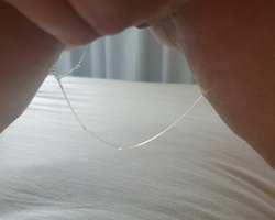 Strands of stringy vaginal grool dangling out of her pussy