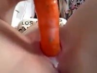 She masturbates with a carrot and tastes her sweet cum
